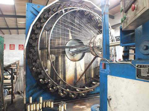 A braid equipment is braiding steel wire on inner tuber of hydraulic hose.