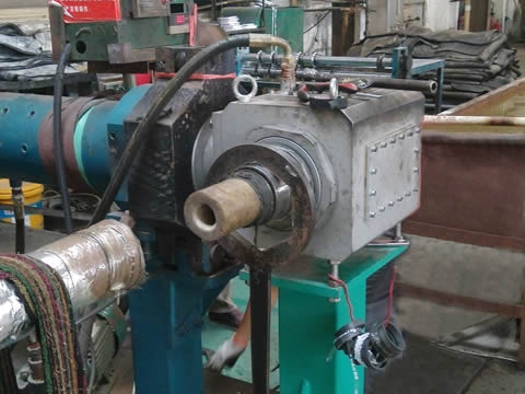 A machine is producing hydraulic hose rubber cover.